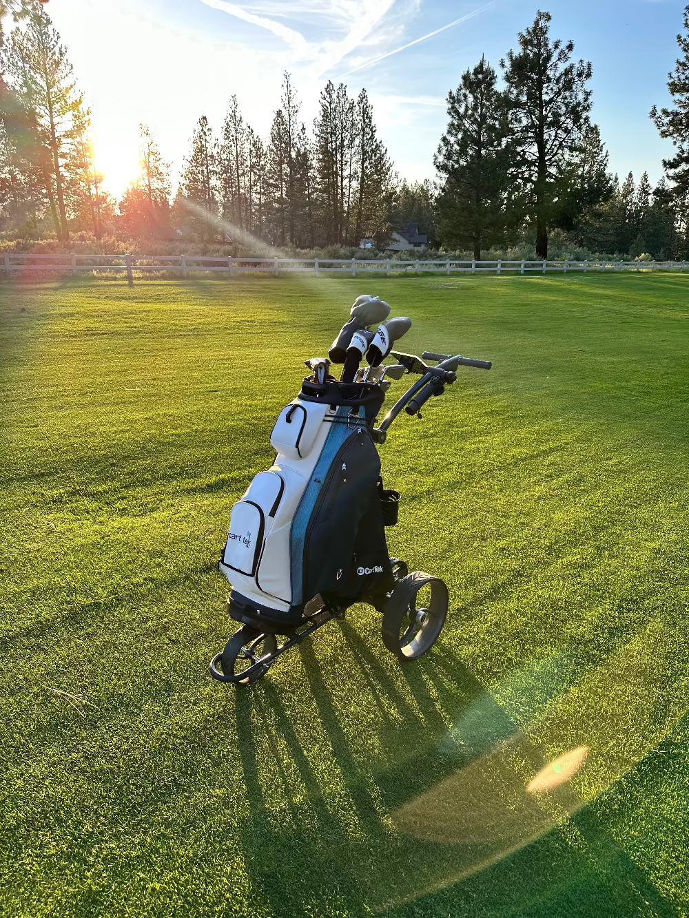 electric golf cart with remote control 1500 V3 black on course with vessel lux golf bag