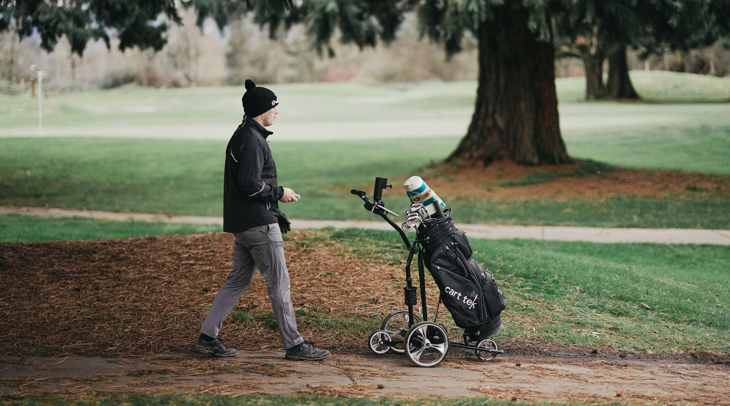 Side profile of the Yellowstone Black remote golf trolley, showcasing its sleek frame, durable wheels, and ergonomic handle. This electric golf cart with remote control provides golfers with effortless mobility and hands-free convenience on the course.