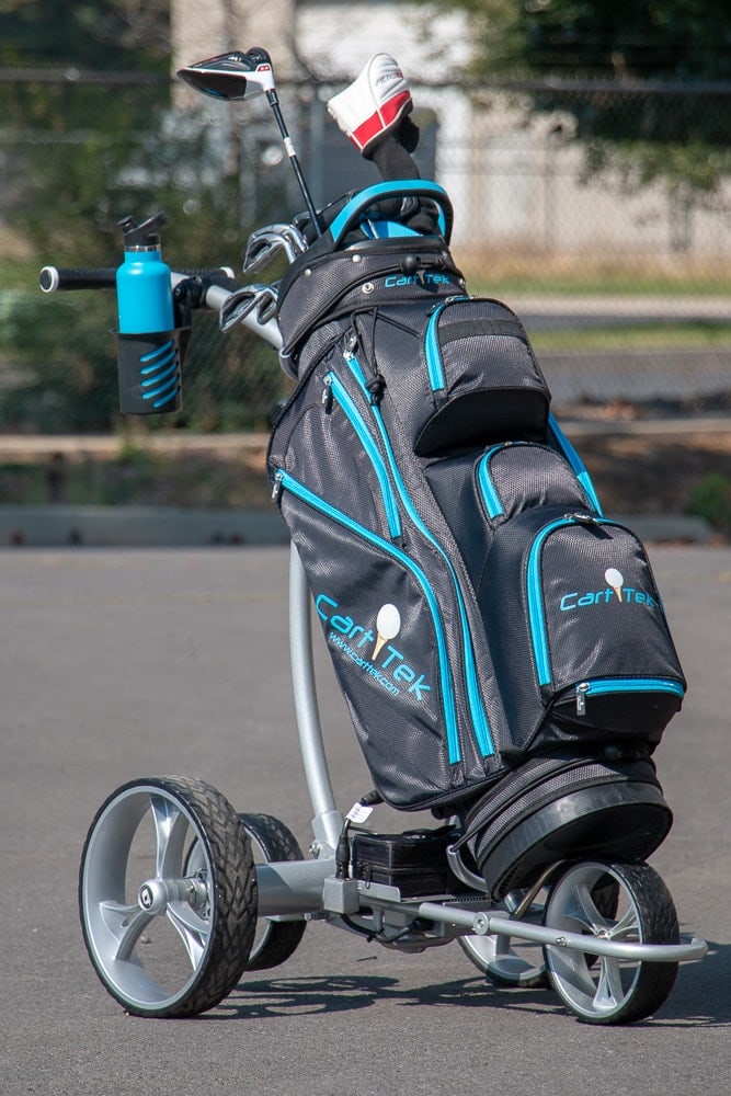 Cart Tek GRI-1500Li remote controlled battery powered golf trolley with new large plastic drink holder and blue golf bag.
