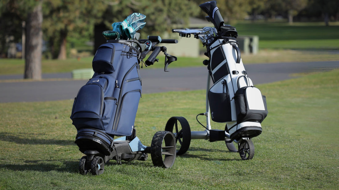 two electric golf push carts on a practice green before a round of golf