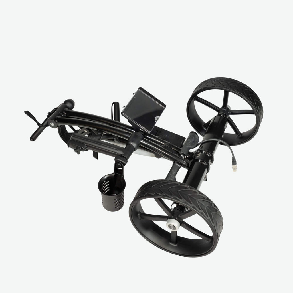 GRi-975Li black electric golf push cart with downhill braking, shown in its folded position. This compact and lightweight electric golf push cart features a space-saving design, making it easy to transport and store. Equipped with a rechargeable lithium battery and advanced braking system, it offers effortless maneuverability on the course.