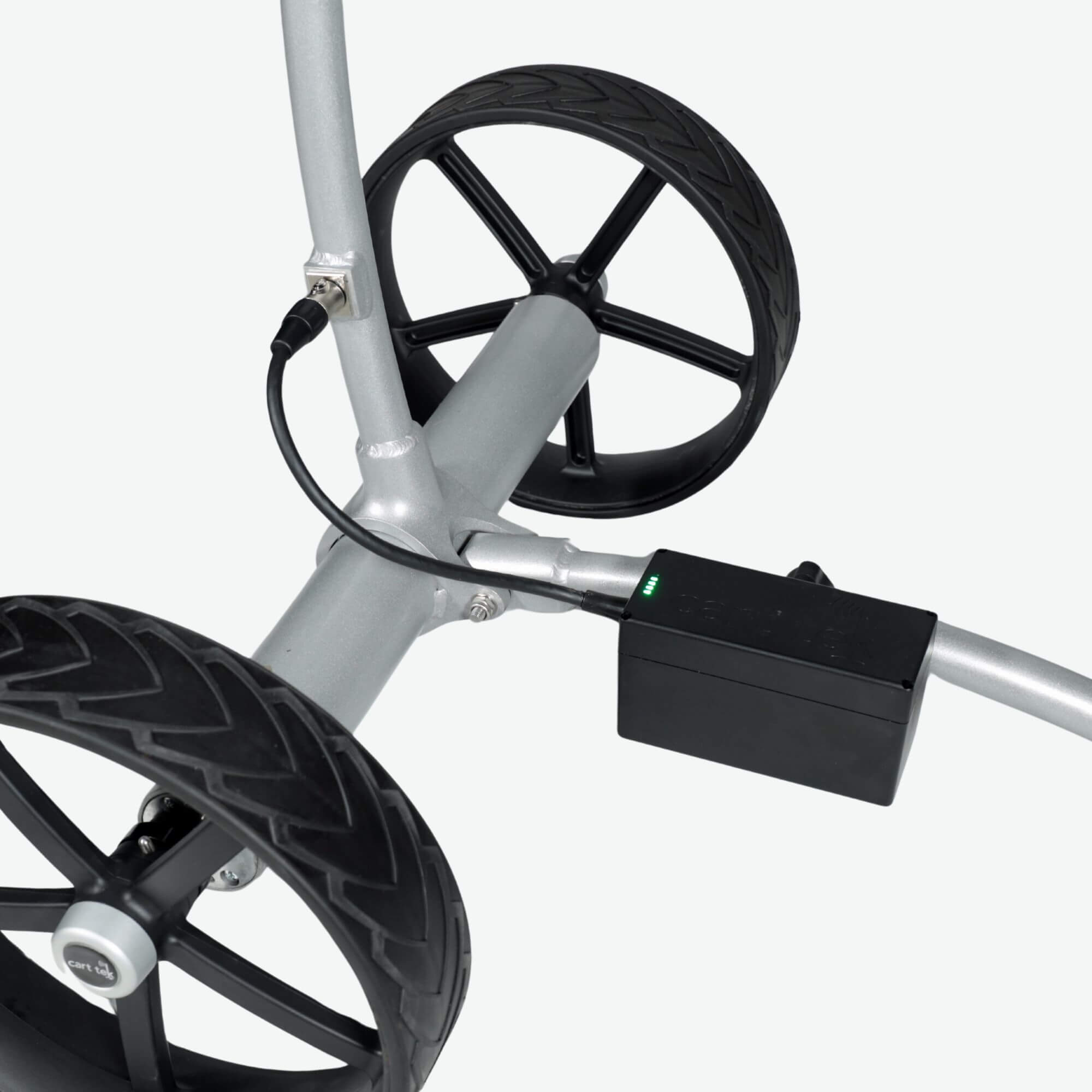 Close-up view of the battery port and battery cable on the GRi-975Li silver electric golf push cart with downhill braking. This detailed shot highlights the cart’s rechargeable lithium battery connection, ensuring efficient power delivery for a smooth and controlled golfing experience.