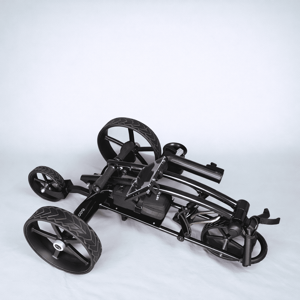 Black Cart Tek 1500 V3 electric golf caddy folded compact for storage, angled top-down studio shot on light gray background.