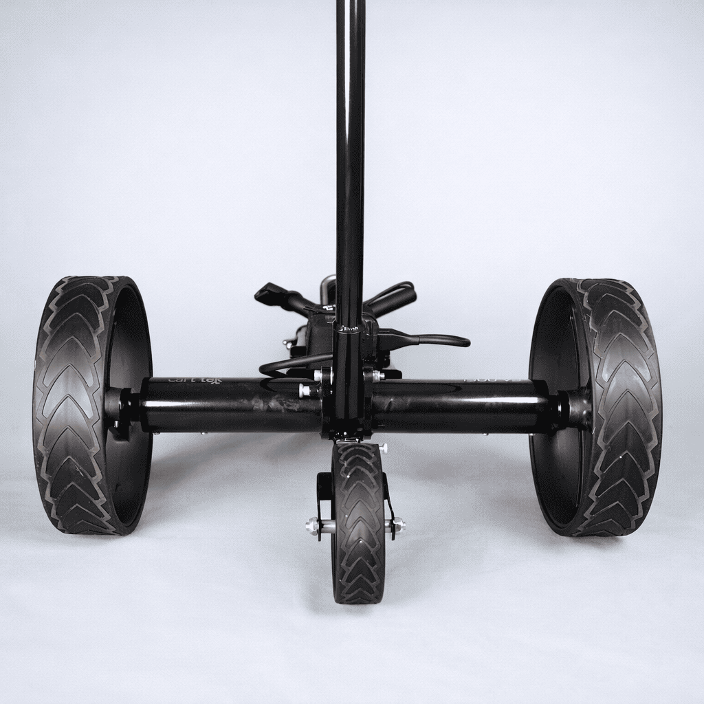 Close-up rear axle and wheel setup on the black Cart Tek 1500 V3 electric golf caddy, showing tire tread and rear wheel assembly.