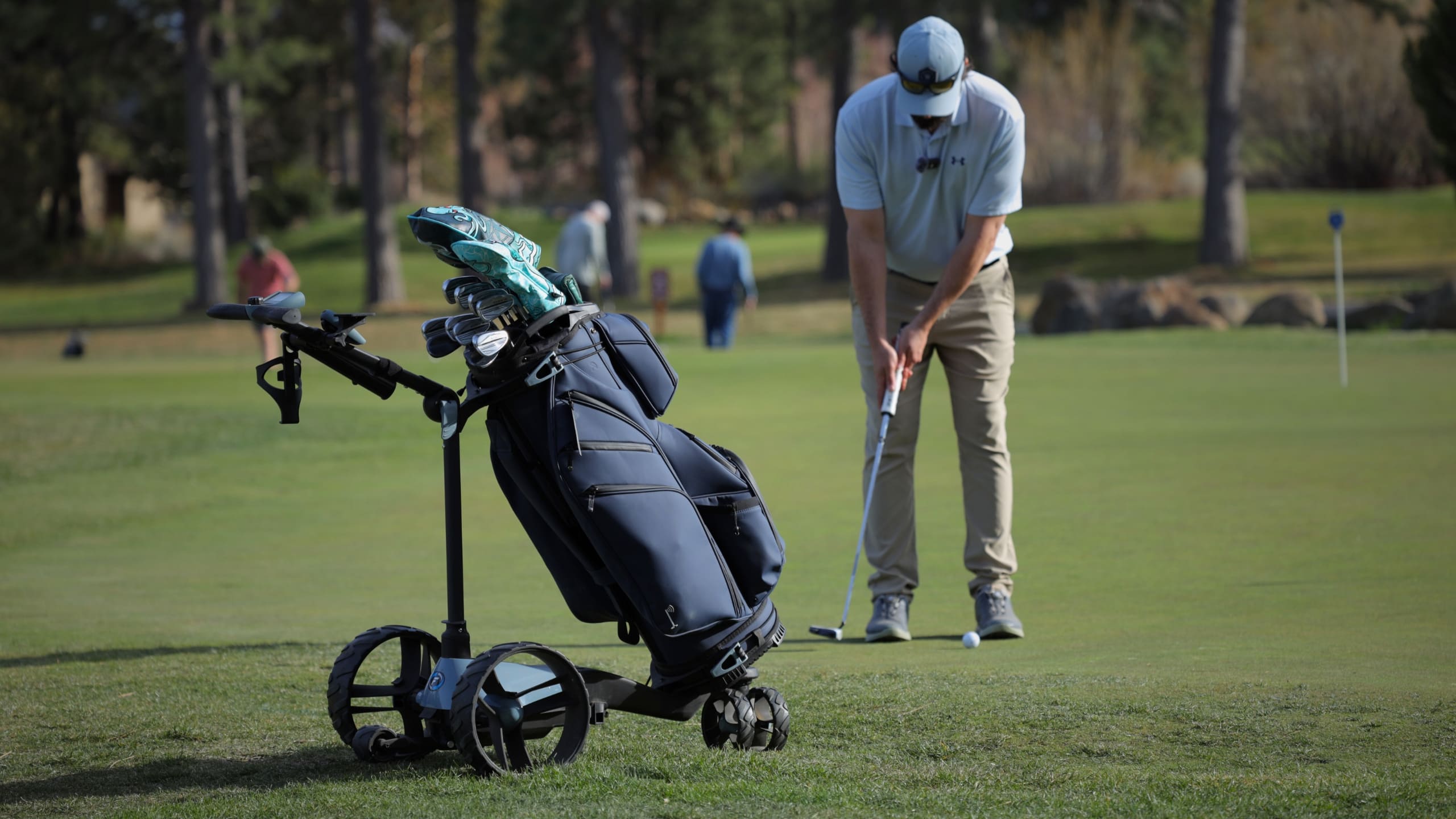 Luxury golf cart bag paired with a remote electric push cart, perfect for ClicGear, Bag Boy, and hilly-course walking golfers.