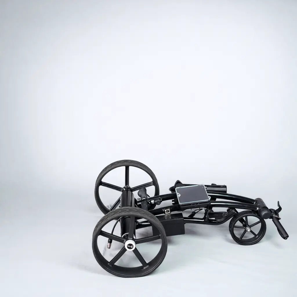 GRi-975Li electric golf trolley folded down for compact transport and storage (wide studio shot)