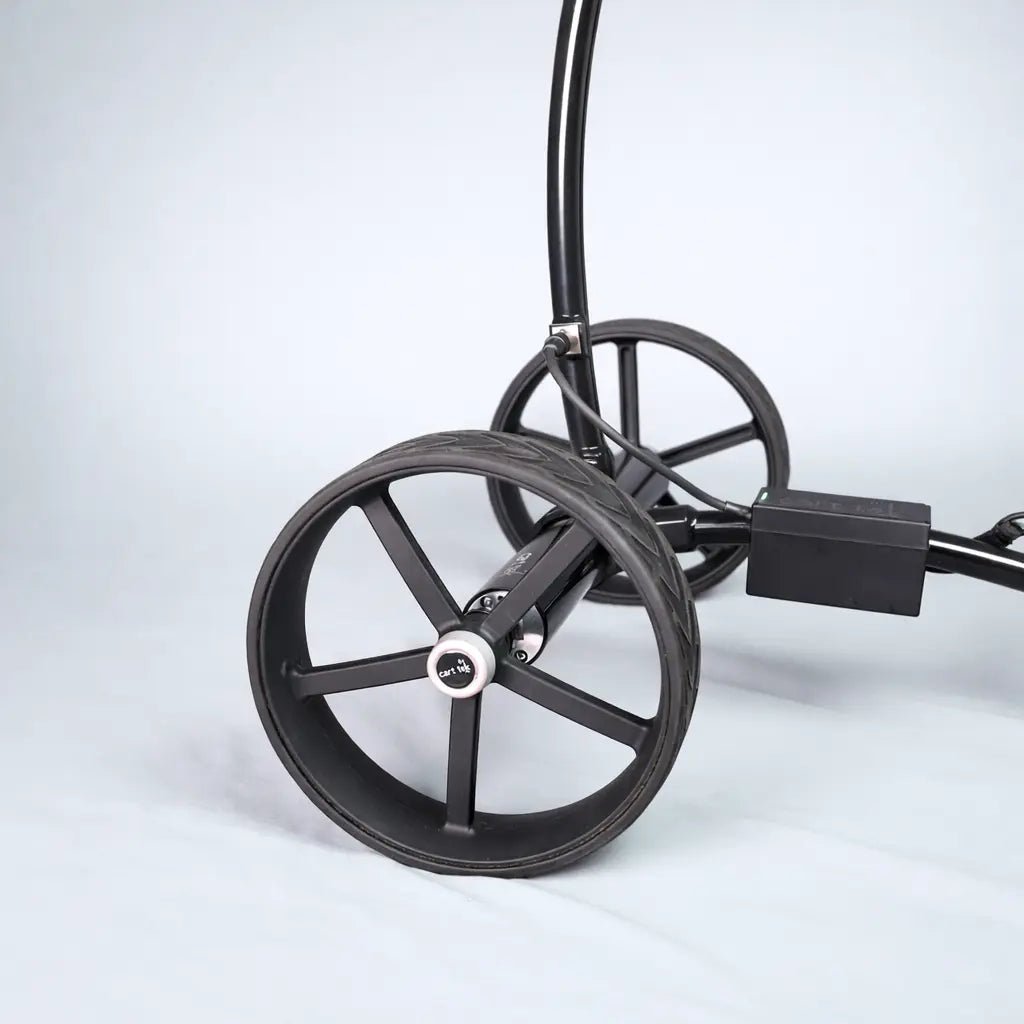 Close-up of GRi-975Li electric golf trolley wheel and axle showing the wide wheel design for stability