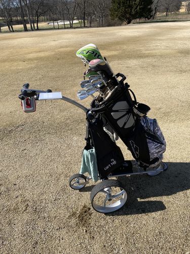 customer electric golf cart on fairway