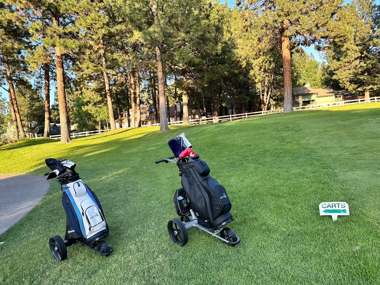 two electric golf cart with remote control 1500 V3's on course with vessel lux golf bags