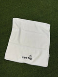 white-microfiber-towel laid on green grass
